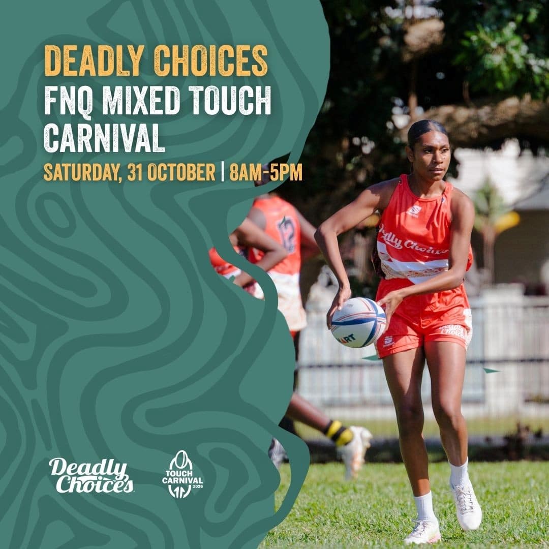 A touch carnival player with a ball on the Cairns footy field